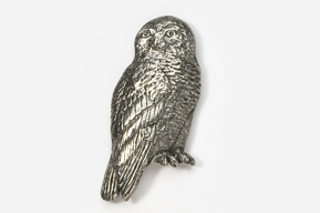 A silver owl sitting on top of a white table.