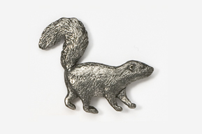 A silver animal is standing up and looking at the ground.