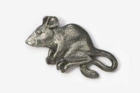 A metal rat is sitting on the ground.