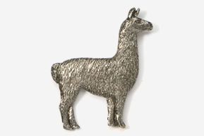 A silver llama standing next to a white wall.