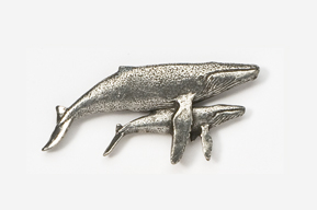 A silver whale and baby whale pin.