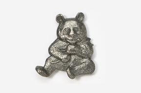 A silver bear sitting on the ground.