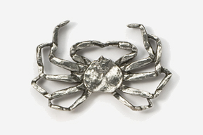 A metal crab with a round center piece.