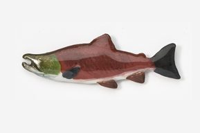 A wooden fish with black and green accents.