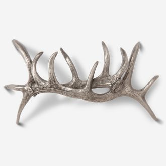 A silver antler is shown on the wall.