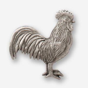 A silver rooster is standing up on the ground.