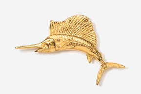 A gold colored fish is hanging on the wall.