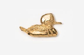 A gold duck pin is shown on a white background.