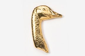 A gold duck is sitting on the ground.