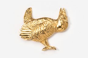 A gold chicken pin is shown here.