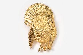 A gold turkey pin is shown in this picture.