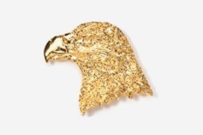 A gold eagle head with a beak on top of it.