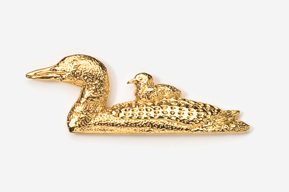 A gold duck with a bird on it's back.