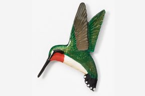 A green and white hummingbird with red beak.