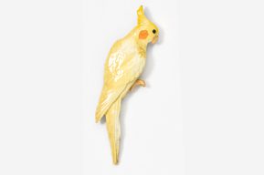 A yellow bird is standing on its hind legs.