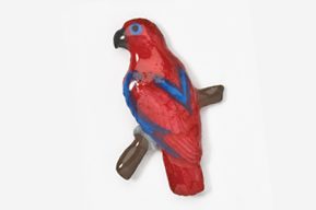 A red and blue parrot is sitting on the branch.