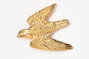 A gold bird is flying in the air.