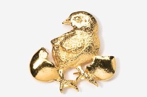 A gold chick with two cracked eggs on it.