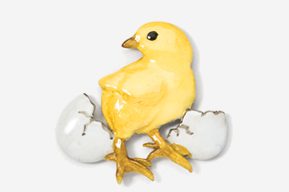 A yellow chick sitting on an egg shell.