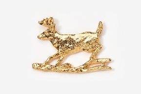 A gold dog is standing on some grass