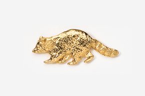 A gold colored animal is shown on the ground.