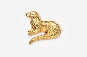 A gold colored animal sitting on top of a white surface.