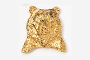 A gold bear head is shown on the wall.