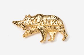 A gold bear with alaska written on it.