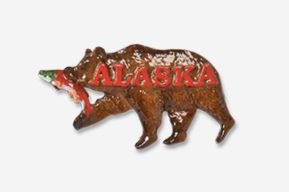 A bear with a fish in its mouth and the word alaska on it.