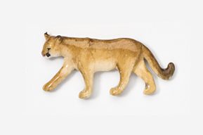 A stuffed animal of a lion cub walking.