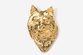 A gold colored animal head with a white background