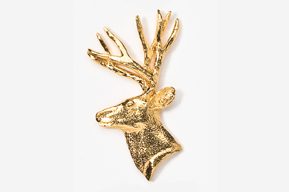 A gold deer head with antlers on top of it.