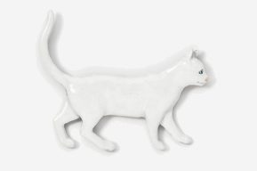 A white cat is standing on its hind legs.