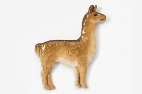 A brown llama standing on top of a white surface.