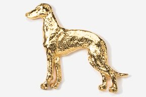 A gold dog is standing in front of the camera.