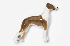 A brown and white dog is standing on its hind legs.