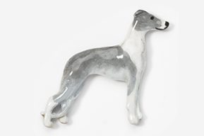 A grey and white dog is standing on its hind legs.