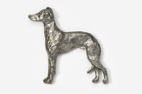 A silver dog standing on top of a white table.