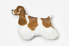 A brown and white dog is laying down