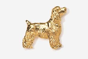 A gold dog is standing up against the wall.