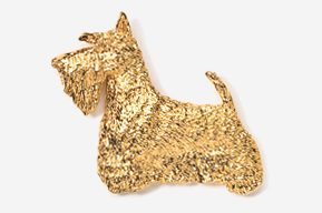 A gold dog is sitting on the ground.