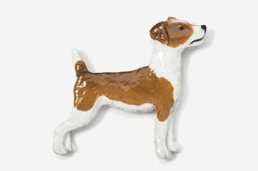 A brown and white dog is standing up