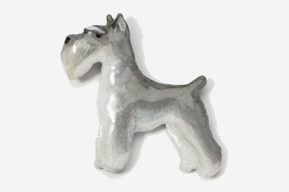 A silver dog is standing up against the wall.