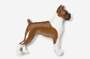 A brown and white dog standing on top of a wall.