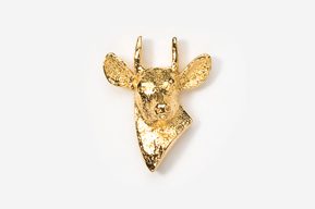 A gold deer head with horns on top of it.