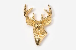 A gold deer head with antlers on top of it.