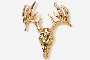 A gold deer head with antlers hanging on the wall.