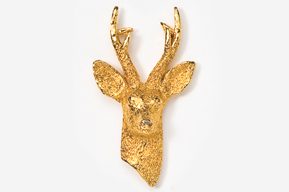 A gold deer head with antlers on top of it.