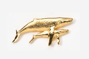 A gold whale and baby whale pin.