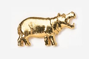 A gold elephant is standing up against the wall.